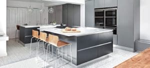 Black kitchen with white marble surface