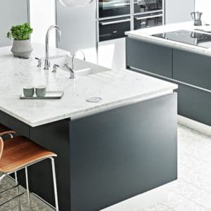 Grey kitchen unit with white marble surface