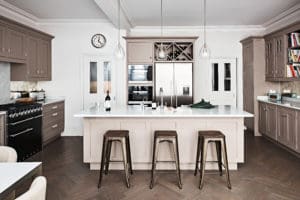 Bespoke kitchen with parquet flooring and marble surfaces