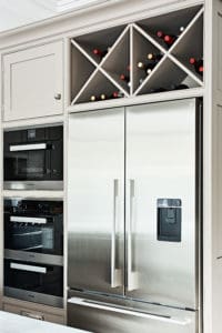 Bespoke kitchen storage with wine rack and fitted refrigerator