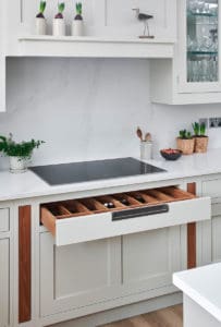 Bespoke kitchen units with drawers and granite surfaces
