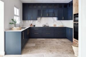Navy blue units with white marble surfaces