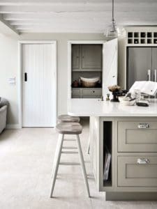 Off white kitchen with white marble surfaces