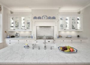 White marble surfaces with white kitchen storages