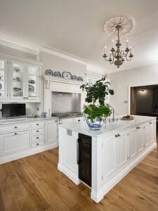 White cupboards with white marble surfaces